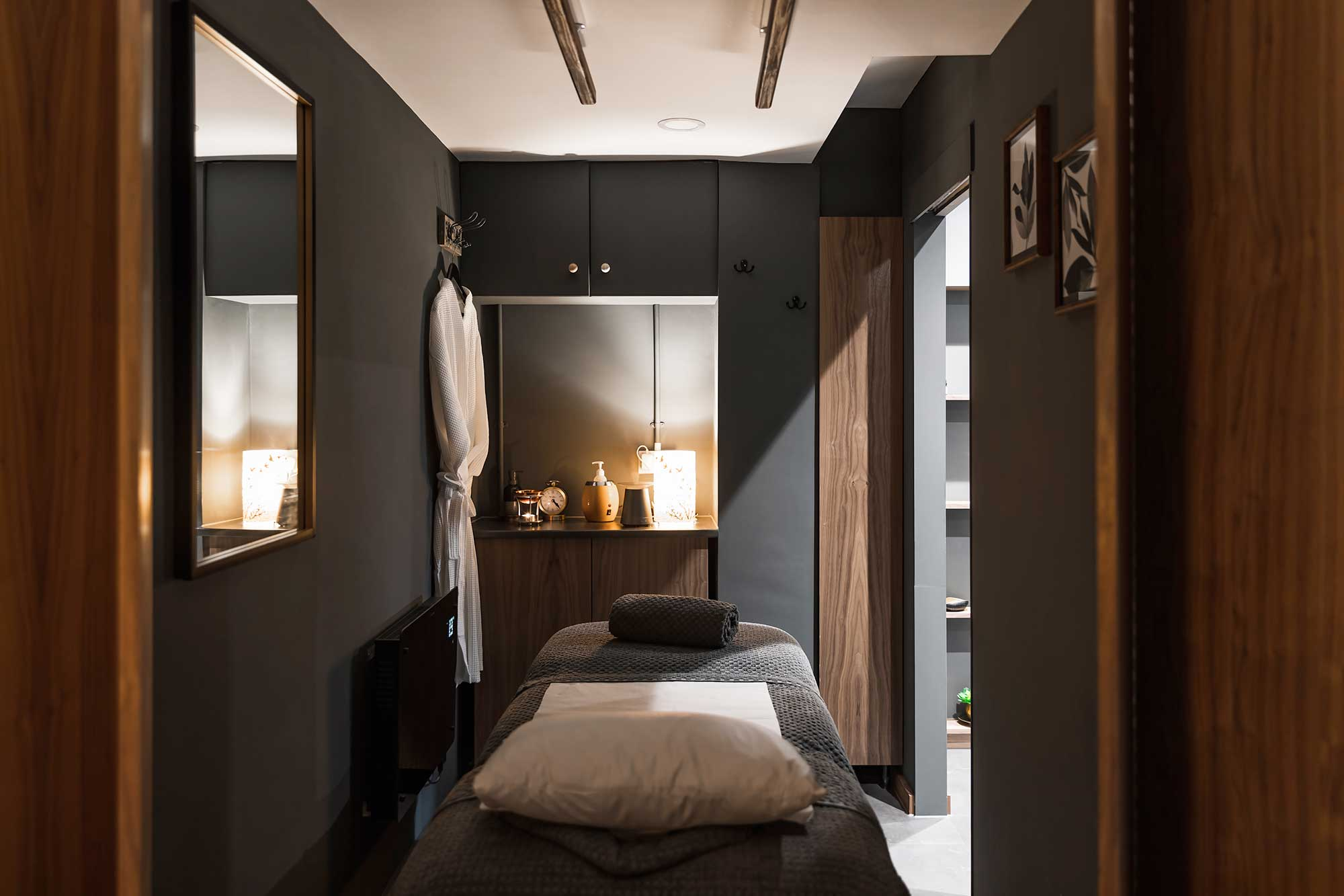 URelax Massage and Spa treatment room with massage bed